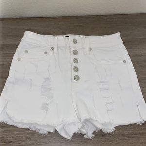 indigo rein, white denim shorts.